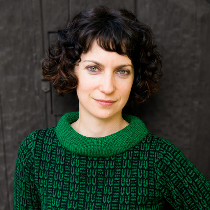 Simone Vitucci green sweater